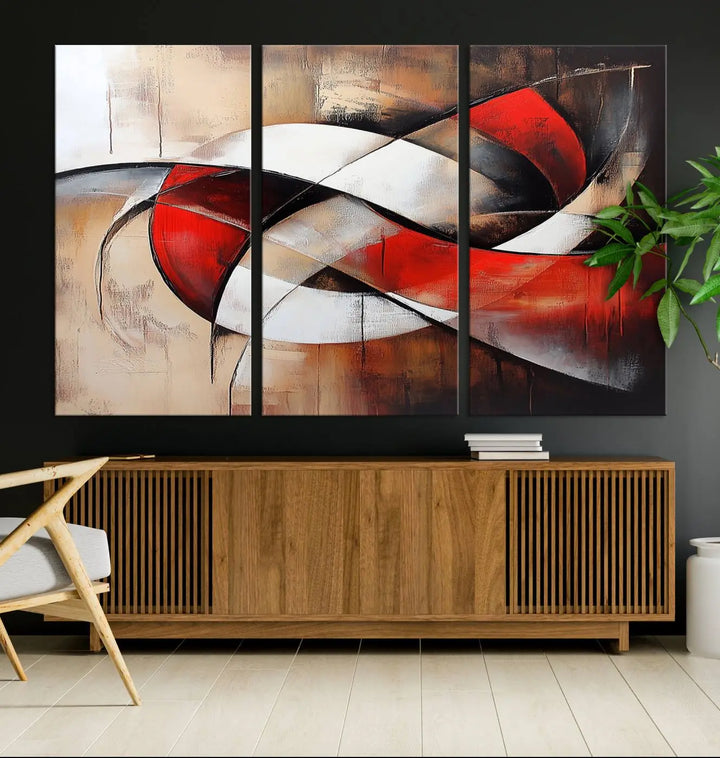 In a contemporary living room, the sunlight casts artistic shadows and highlights an abstract triptych wall art featuring bold red and white geometric shapes.