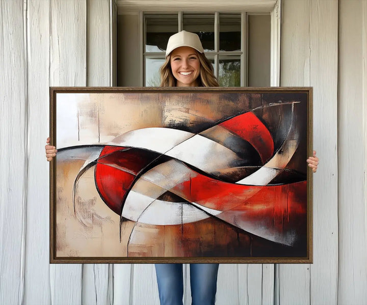 The "Abstract Wall Art - Modern Red and White Canvas Wall Art Print" features bold geometric shapes in red, black, and white on a beige background, enhancing contemporary aesthetics. This canvas print adds a striking focal point to any room, beautifully complementing the modern vibe of the space.