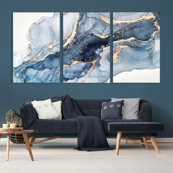 An abstract art print with fluid blue and gold hangs elegantly on the wall.