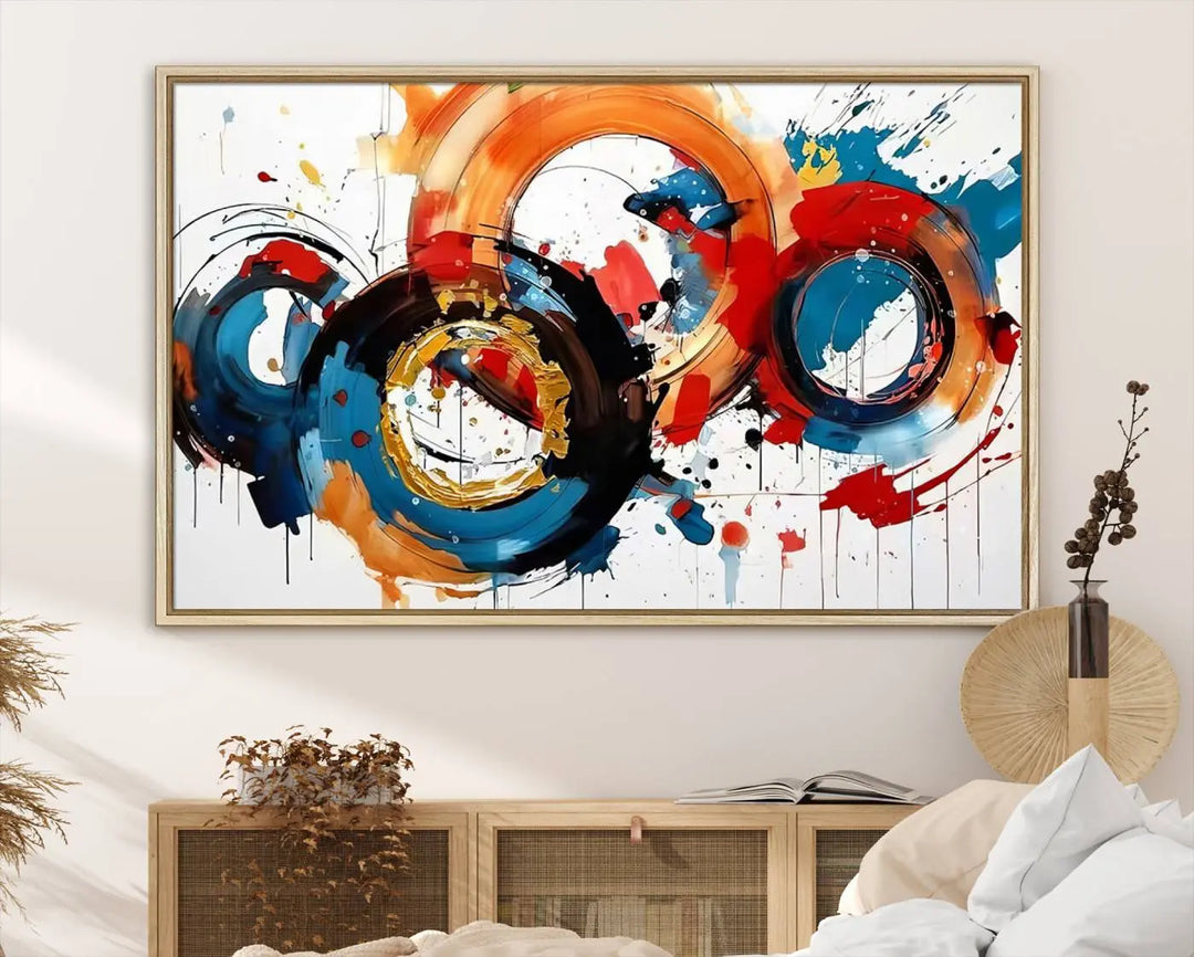 The Abstract Wall Art Rings Canvas Print, with its bold and colorful circular strokes, adorns the wall, epitomizing contemporary design.