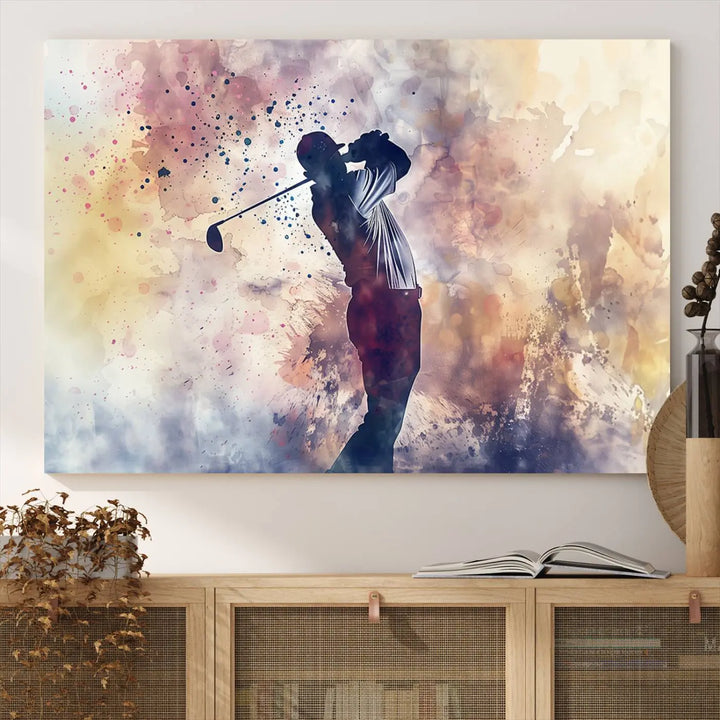 The Abstract Watercolor Golf Player Wall Art Canvas Print, with its vibrant abstract splashes, infuses dynamic energy into the room and harmonizes effortlessly with modern decor. This impressive piece captures the essence of contemporary golf art.