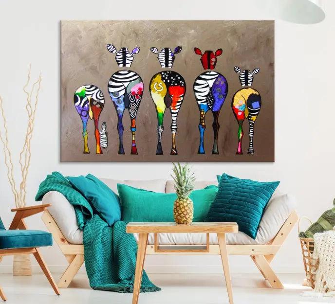 The Abstract Zebras Wall Art Canvas Print features a three-panel design of colorful zebra backs printed on museum-quality canvas. It comes ready to hang for easy installation and is protected with a UV-coating to maintain its vibrant hues.