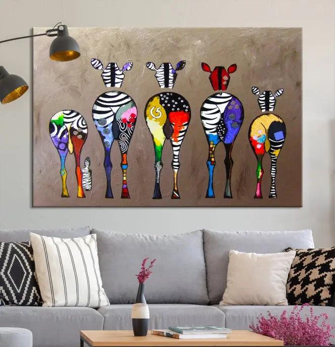 The Abstract Zebras Wall Art Canvas Print features a three-panel design of colorful zebra backs printed on museum-quality canvas. It comes ready to hang for easy installation and is protected with a UV-coating to maintain its vibrant hues.