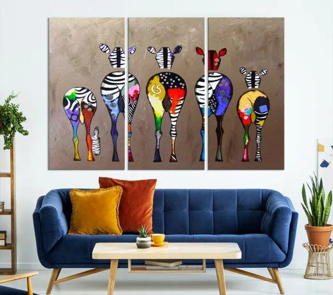 The Abstract Zebras Wall Art Canvas Print features a three-panel design of colorful zebra backs printed on museum-quality canvas. It comes ready to hang for easy installation and is protected with a UV-coating to maintain its vibrant hues.