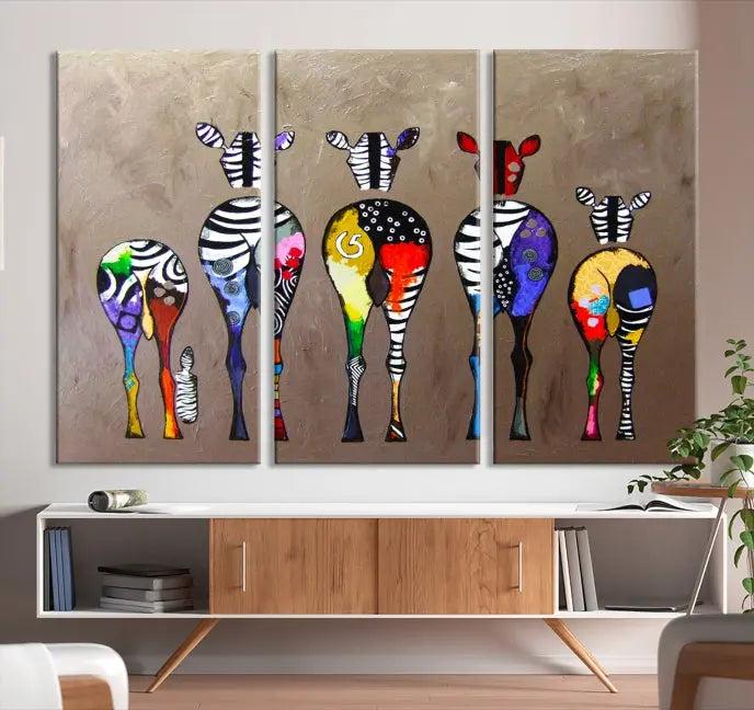 The Abstract Zebras Wall Art Canvas Print features a three-panel design of colorful zebra backs printed on museum-quality canvas. It comes ready to hang for easy installation and is protected with a UV-coating to maintain its vibrant hues.