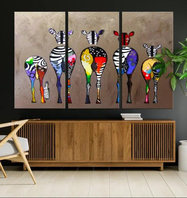 The Abstract Zebras Wall Art Canvas Print features a three-panel design of colorful zebra backs printed on museum-quality canvas. It comes ready to hang for easy installation and is protected with a UV-coating to maintain its vibrant hues.