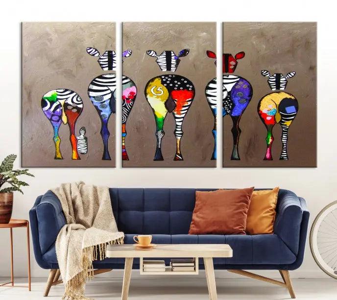 The Abstract Zebras Wall Art Canvas Print features a three-panel design of colorful zebra backs printed on museum-quality canvas. It comes ready to hang for easy installation and is protected with a UV-coating to maintain its vibrant hues.