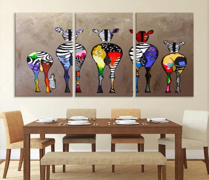 The Abstract Zebras Wall Art Canvas Print features a three-panel design of colorful zebra backs printed on museum-quality canvas. It comes ready to hang for easy installation and is protected with a UV-coating to maintain its vibrant hues.