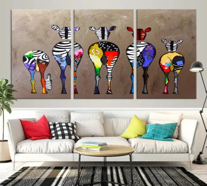 The Abstract Zebras Wall Art Canvas Print features a three-panel design of colorful zebra backs printed on museum-quality canvas. It comes ready to hang for easy installation and is protected with a UV-coating to maintain its vibrant hues.