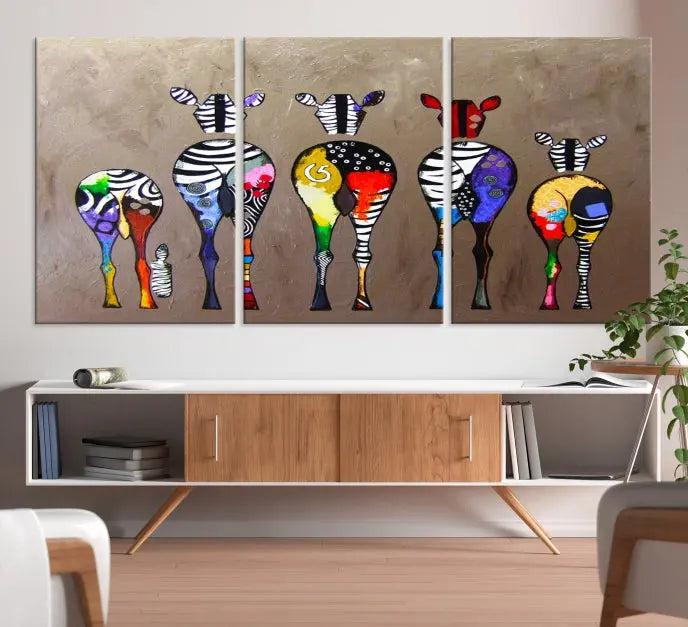 The Abstract Zebras Wall Art Canvas Print features a three-panel design of colorful zebra backs printed on museum-quality canvas. It comes ready to hang for easy installation and is protected with a UV-coating to maintain its vibrant hues.