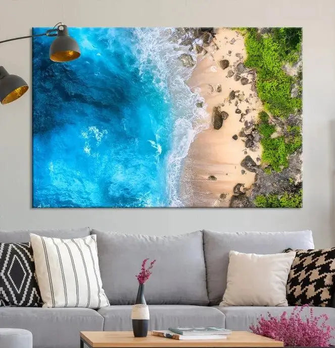 The Aerial Ocean Beach Canvas Wall Art Print is elegantly displayed, boasting a UV-protective coating to ensure enduring vibrancy. This museum-quality canvas piece is prepped for easy hanging.