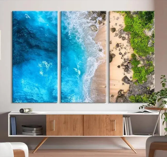 The Aerial Ocean Beach Canvas Wall Art Print is elegantly displayed, boasting a UV-protective coating to ensure enduring vibrancy. This museum-quality canvas piece is prepped for easy hanging.