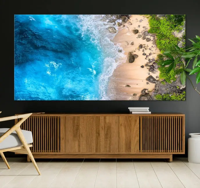 The Aerial Ocean Beach Canvas Wall Art Print is elegantly displayed, boasting a UV-protective coating to ensure enduring vibrancy. This museum-quality canvas piece is prepped for easy hanging.