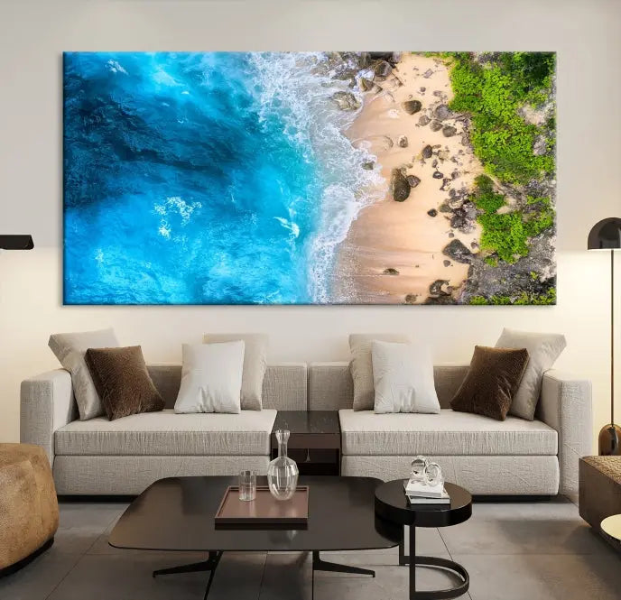 The Aerial Ocean Beach Canvas Wall Art Print is elegantly displayed, boasting a UV-protective coating to ensure enduring vibrancy. This museum-quality canvas piece is prepped for easy hanging.