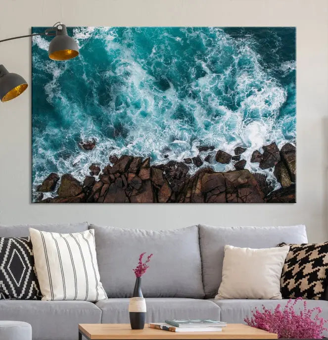 The "Aerial Ocean Wall Art Canvas Print," crafted from polycotton canvas, adorns the wall and adds museum-quality elegance to your space. This ready-to-hang artwork is a striking addition to any room.