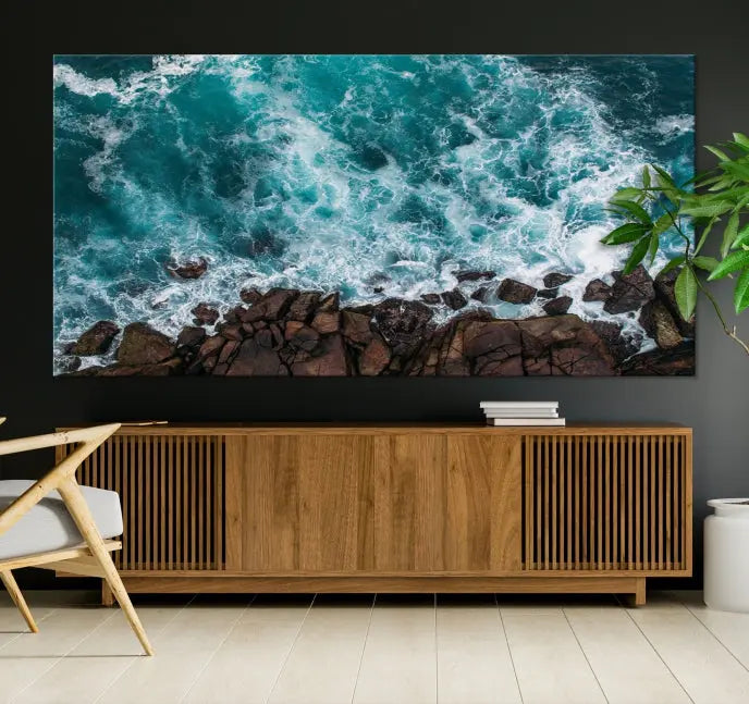 The "Aerial Ocean Wall Art Canvas Print," crafted from polycotton canvas, adorns the wall and adds museum-quality elegance to your space. This ready-to-hang artwork is a striking addition to any room.