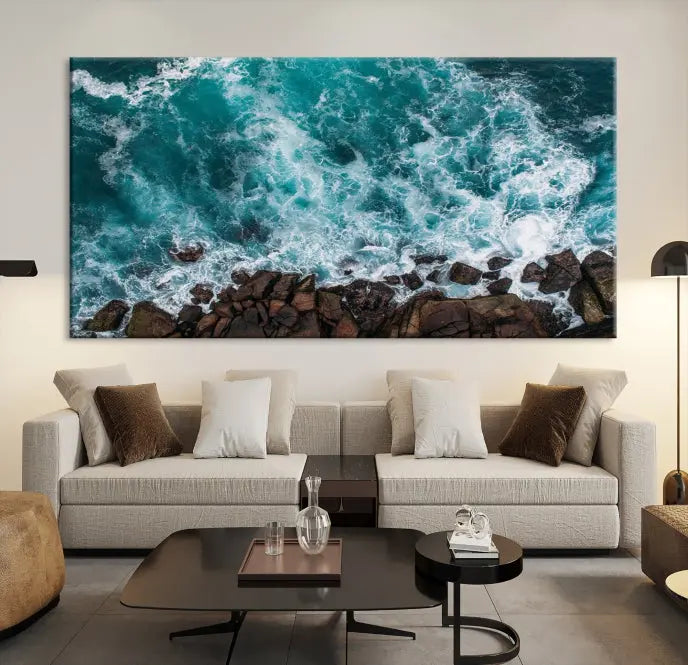 The "Aerial Ocean Wall Art Canvas Print," crafted from polycotton canvas, adorns the wall and adds museum-quality elegance to your space. This ready-to-hang artwork is a striking addition to any room.