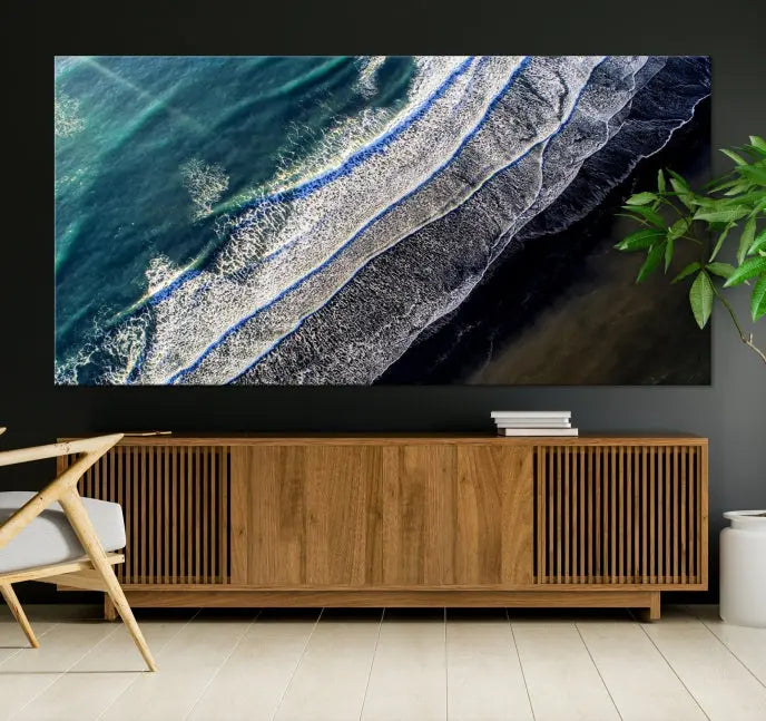 The Aerial Seashore Ocean Wall Art Canvas Print features an aerial view of ocean waves on museum-quality canvases with hand-assembled frames.