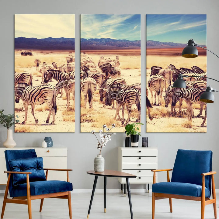 The Africa Zebras in the Savannah Canvas Wall Art Print features a zebra triptych on museum-quality canvas. This gallery-wrapped artwork is finished with a UV-protective coating, ensuring lasting vibrancy and elegance.