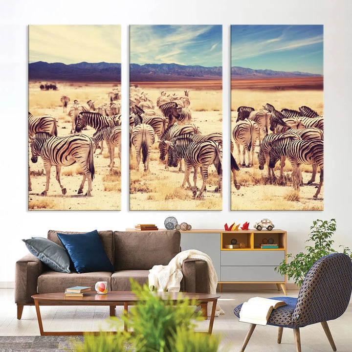 The Africa Zebras in the Savannah Canvas Wall Art Print features a zebra triptych on museum-quality canvas. This gallery-wrapped artwork is finished with a UV-protective coating, ensuring lasting vibrancy and elegance.