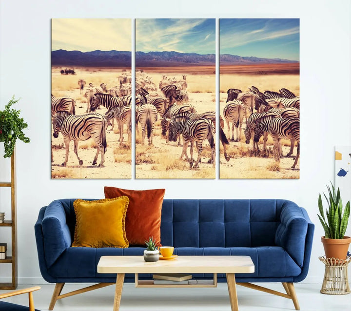 The Africa Zebras in the Savannah Canvas Wall Art Print features a zebra triptych on museum-quality canvas. This gallery-wrapped artwork is finished with a UV-protective coating, ensuring lasting vibrancy and elegance.