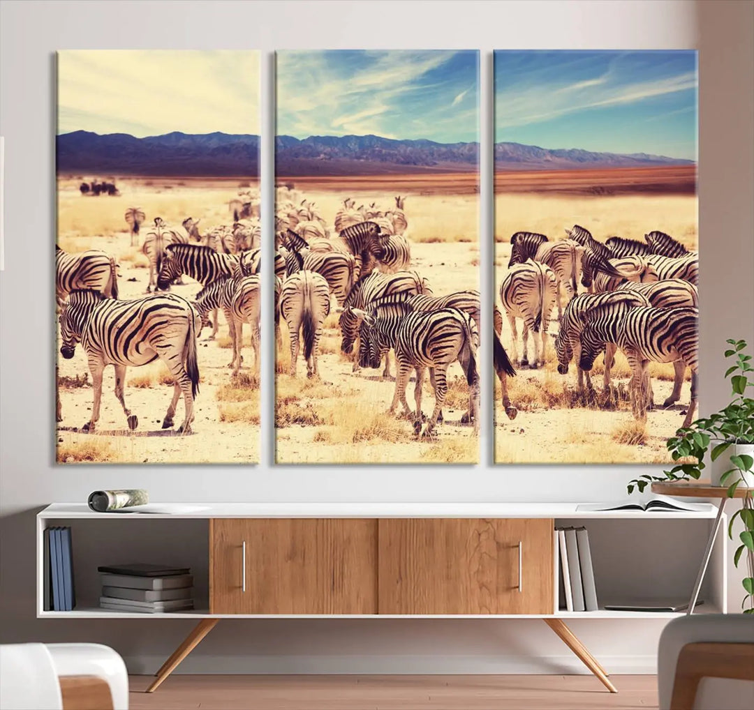 The Africa Zebras in the Savannah Canvas Wall Art Print features a zebra triptych on museum-quality canvas. This gallery-wrapped artwork is finished with a UV-protective coating, ensuring lasting vibrancy and elegance.