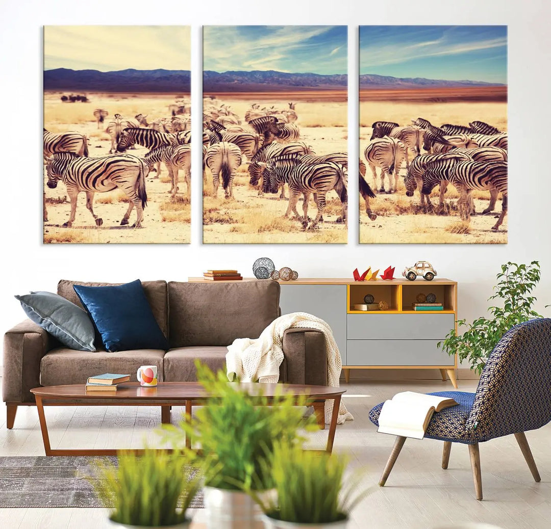 The Africa Zebras in the Savannah Canvas Wall Art Print features a zebra triptych on museum-quality canvas. This gallery-wrapped artwork is finished with a UV-protective coating, ensuring lasting vibrancy and elegance.