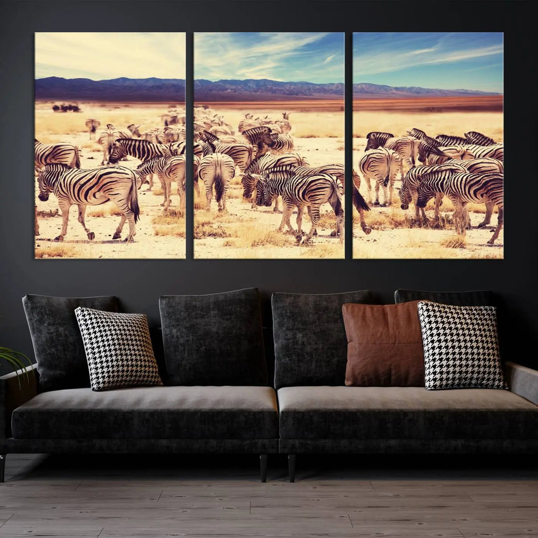 The Africa Zebras in the Savannah Canvas Wall Art Print features a zebra triptych on museum-quality canvas. This gallery-wrapped artwork is finished with a UV-protective coating, ensuring lasting vibrancy and elegance.