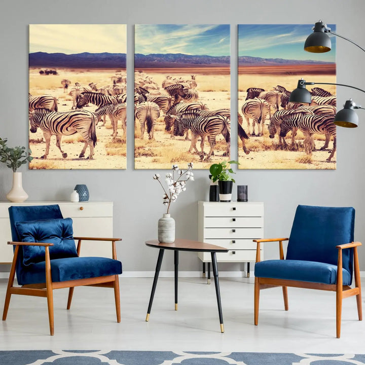 The Africa Zebras in the Savannah Canvas Wall Art Print features a zebra triptych on museum-quality canvas. This gallery-wrapped artwork is finished with a UV-protective coating, ensuring lasting vibrancy and elegance.