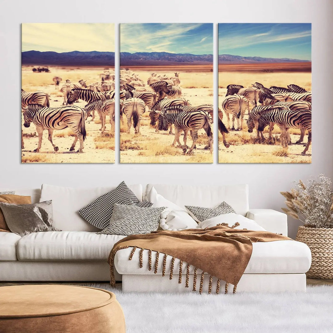 The Africa Zebras in the Savannah Canvas Wall Art Print features a zebra triptych on museum-quality canvas. This gallery-wrapped artwork is finished with a UV-protective coating, ensuring lasting vibrancy and elegance.