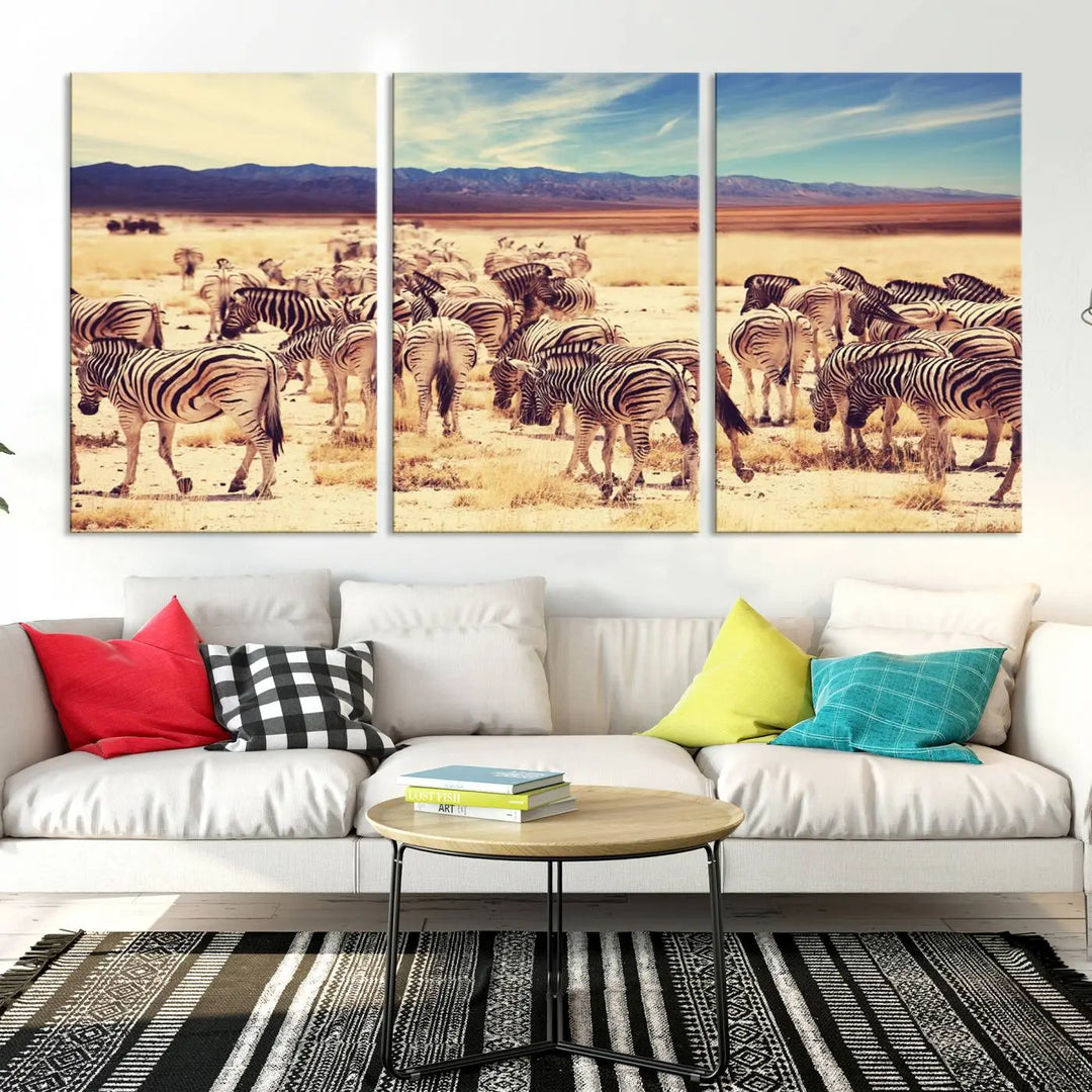 The Africa Zebras in the Savannah Canvas Wall Art Print features a zebra triptych on museum-quality canvas. This gallery-wrapped artwork is finished with a UV-protective coating, ensuring lasting vibrancy and elegance.