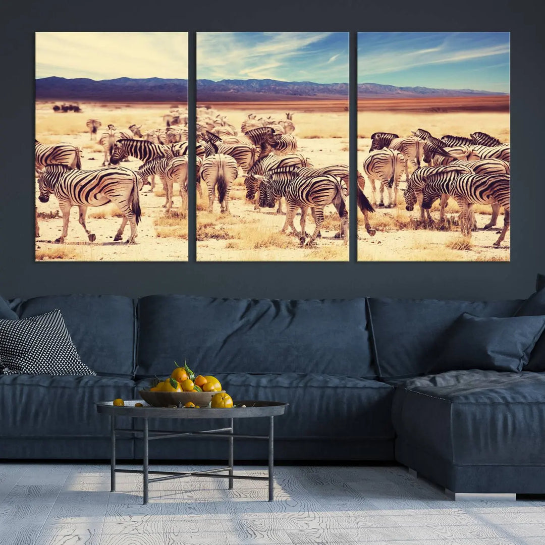 The Africa Zebras in the Savannah Canvas Wall Art Print features a zebra triptych on museum-quality canvas. This gallery-wrapped artwork is finished with a UV-protective coating, ensuring lasting vibrancy and elegance.