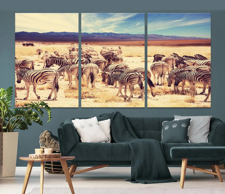 The Africa Zebras in the Savannah Canvas Wall Art Print features a zebra triptych on museum-quality canvas. This gallery-wrapped artwork is finished with a UV-protective coating, ensuring lasting vibrancy and elegance.