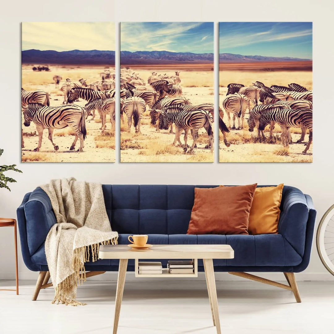 The Africa Zebras in the Savannah Canvas Wall Art Print features a zebra triptych on museum-quality canvas. This gallery-wrapped artwork is finished with a UV-protective coating, ensuring lasting vibrancy and elegance.