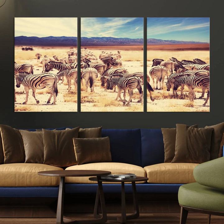 The Africa Zebras in the Savannah Canvas Wall Art Print features a zebra triptych on museum-quality canvas. This gallery-wrapped artwork is finished with a UV-protective coating, ensuring lasting vibrancy and elegance.