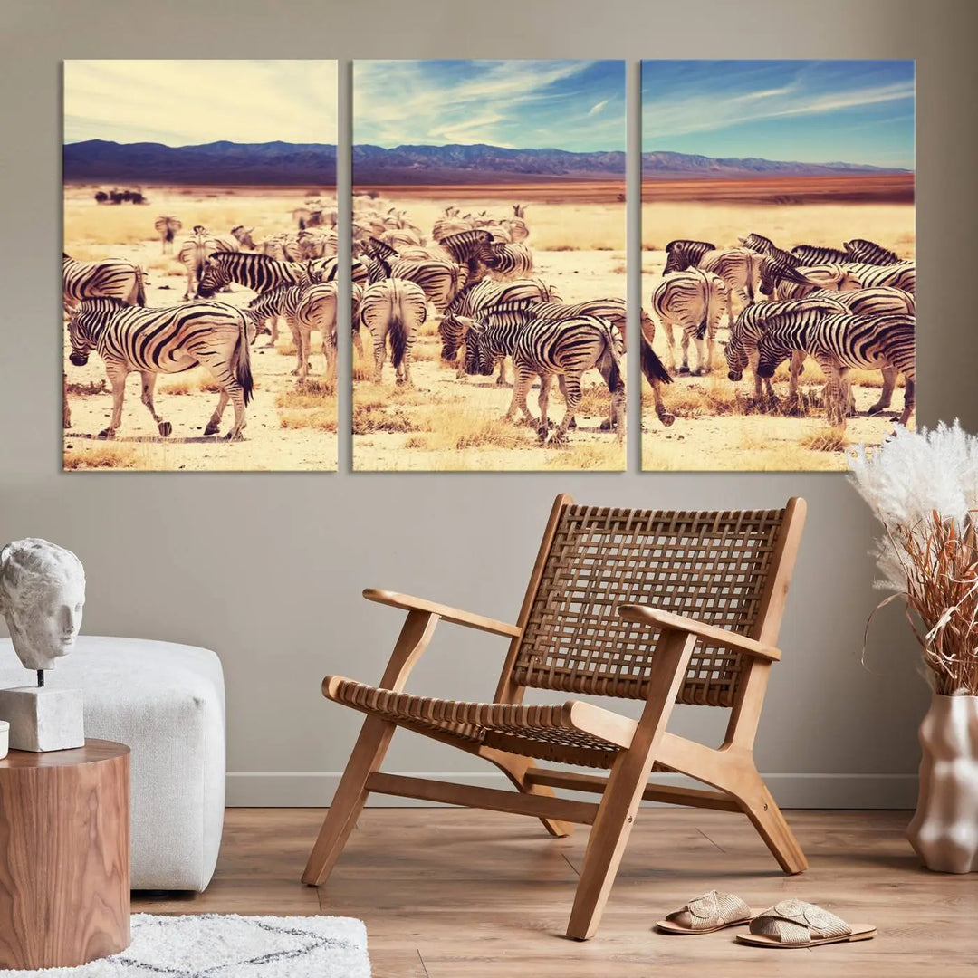 The Africa Zebras in the Savannah Canvas Wall Art Print features a zebra triptych on museum-quality canvas. This gallery-wrapped artwork is finished with a UV-protective coating, ensuring lasting vibrancy and elegance.