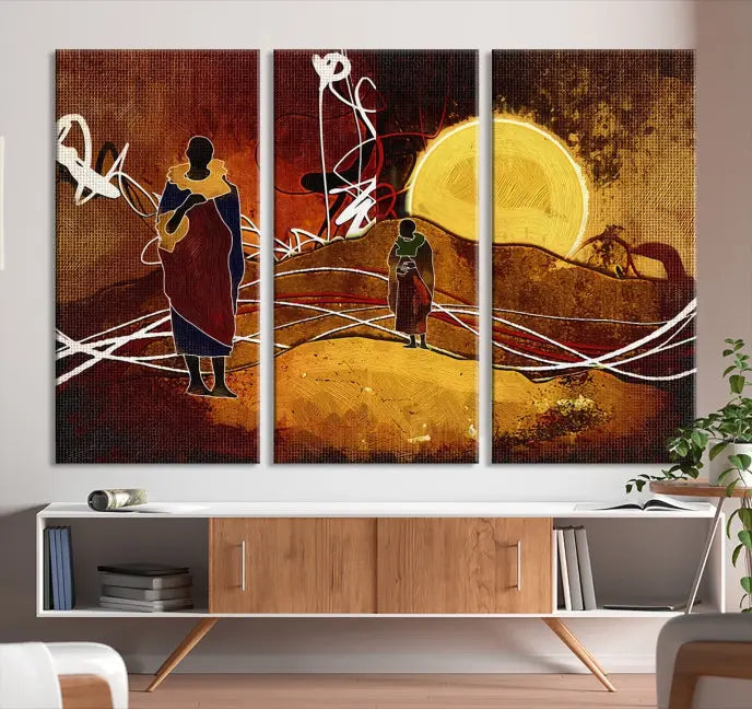 African Abstract Canvas Wall Art Print features a triptych painting of silhouettes on a warm landscape with abstract lines and a large sun. It is mounted on museum-quality canvas with a UV-protective coating.