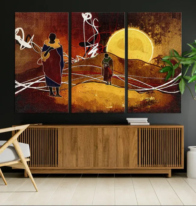 African Abstract Canvas Wall Art Print features a triptych painting of silhouettes on a warm landscape with abstract lines and a large sun. It is mounted on museum-quality canvas with a UV-protective coating.