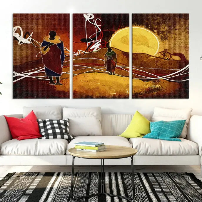 African Abstract Canvas Wall Art Print features a triptych painting of silhouettes on a warm landscape with abstract lines and a large sun. It is mounted on museum-quality canvas with a UV-protective coating.