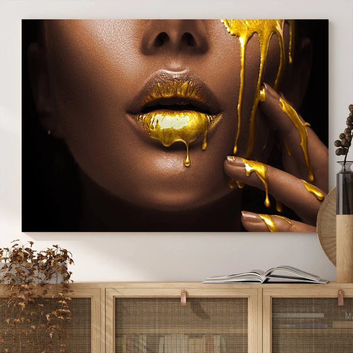 A triptych art display of the African American Art Black Woman Canvas Print, featuring gold-painted lips inspired by fashion and luxury, is elegantly arranged.