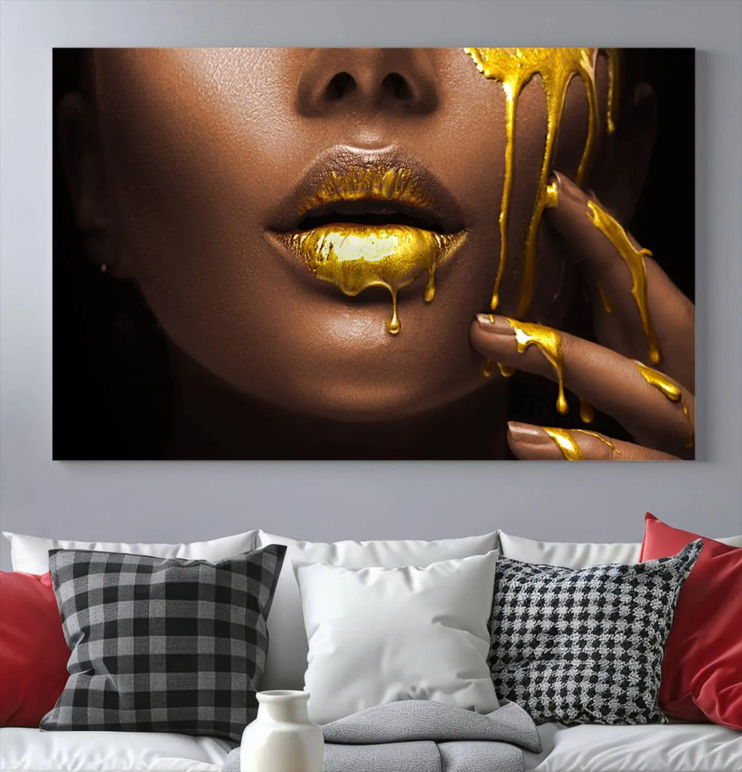 A triptych art display of the African American Art Black Woman Canvas Print, featuring gold-painted lips inspired by fashion and luxury, is elegantly arranged.