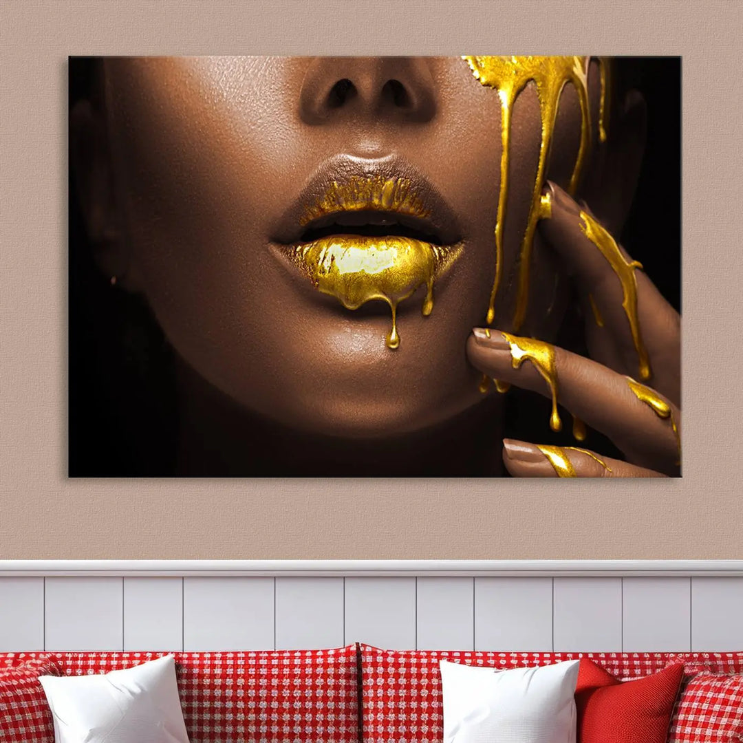 A triptych art display of the African American Art Black Woman Canvas Print, featuring gold-painted lips inspired by fashion and luxury, is elegantly arranged.