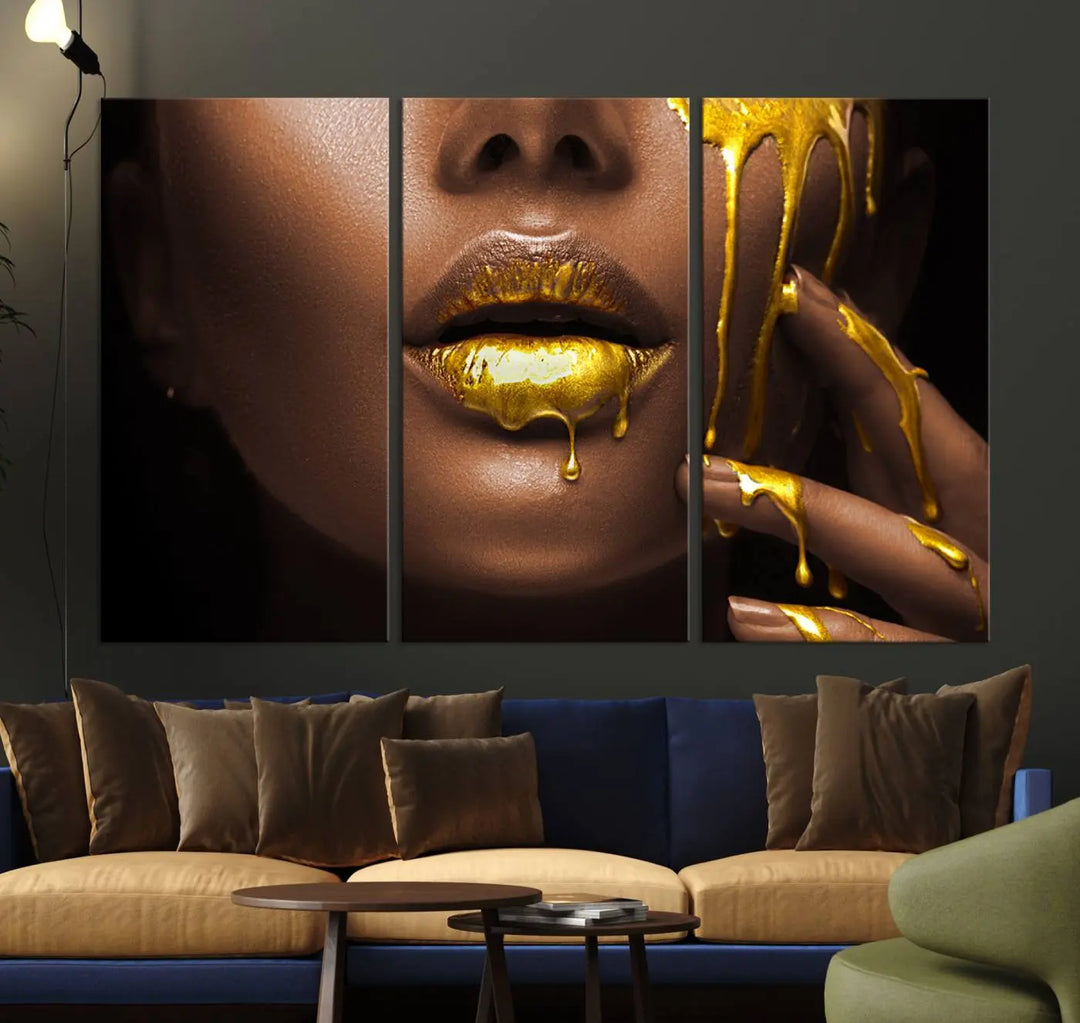 A triptych art display of the African American Art Black Woman Canvas Print, featuring gold-painted lips inspired by fashion and luxury, is elegantly arranged.