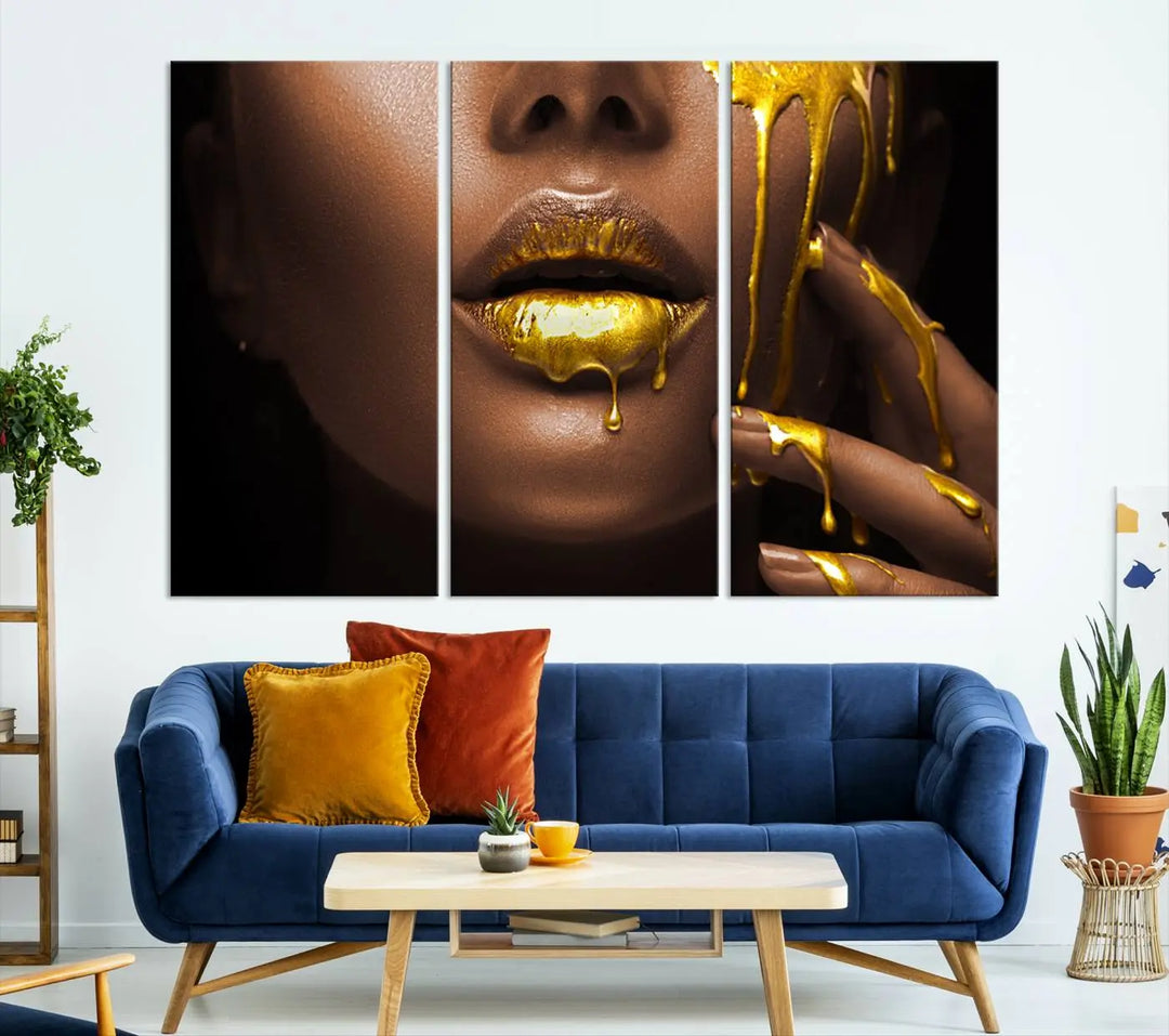 A triptych art display of the African American Art Black Woman Canvas Print, featuring gold-painted lips inspired by fashion and luxury, is elegantly arranged.