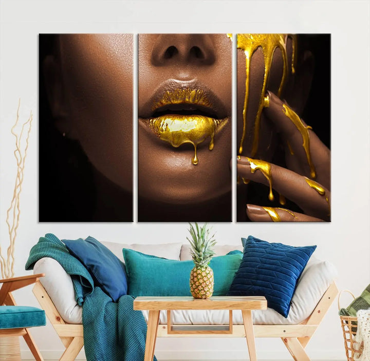 A triptych art display of the African American Art Black Woman Canvas Print, featuring gold-painted lips inspired by fashion and luxury, is elegantly arranged.