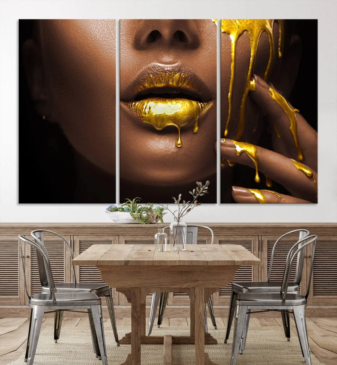 A triptych art display of the African American Art Black Woman Canvas Print, featuring gold-painted lips inspired by fashion and luxury, is elegantly arranged.