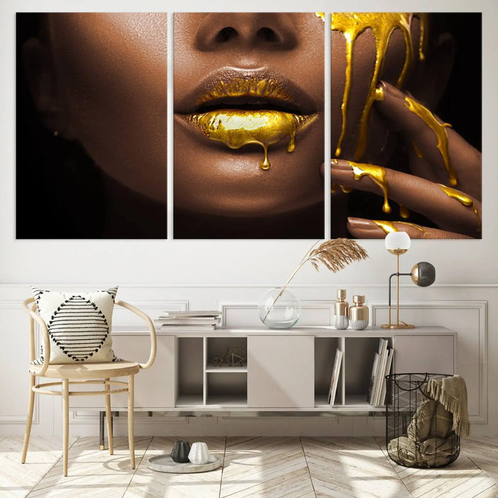 A triptych art display of the African American Art Black Woman Canvas Print, featuring gold-painted lips inspired by fashion and luxury, is elegantly arranged.