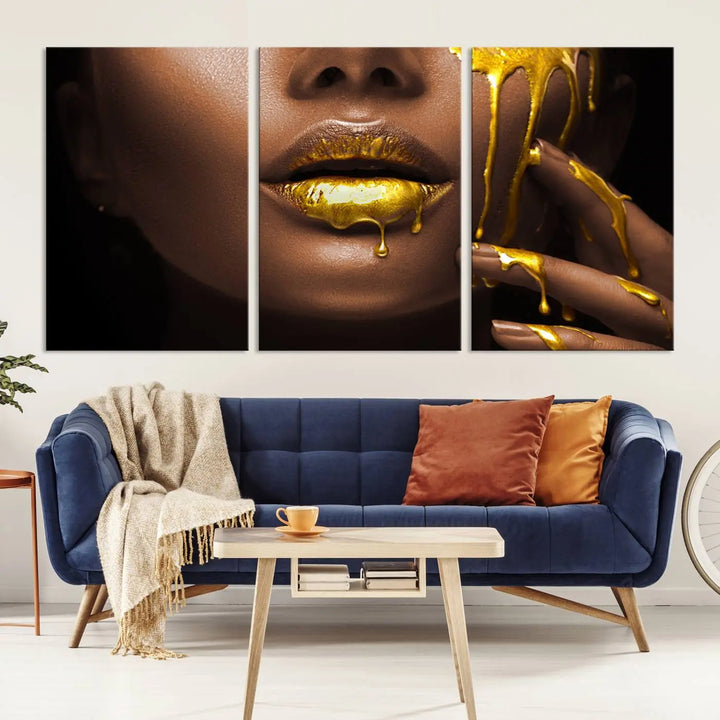 A triptych art display of the African American Art Black Woman Canvas Print, featuring gold-painted lips inspired by fashion and luxury, is elegantly arranged.