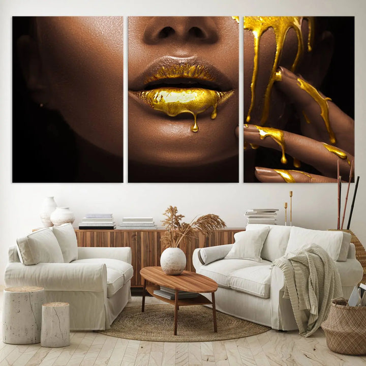 A triptych art display of the African American Art Black Woman Canvas Print, featuring gold-painted lips inspired by fashion and luxury, is elegantly arranged.