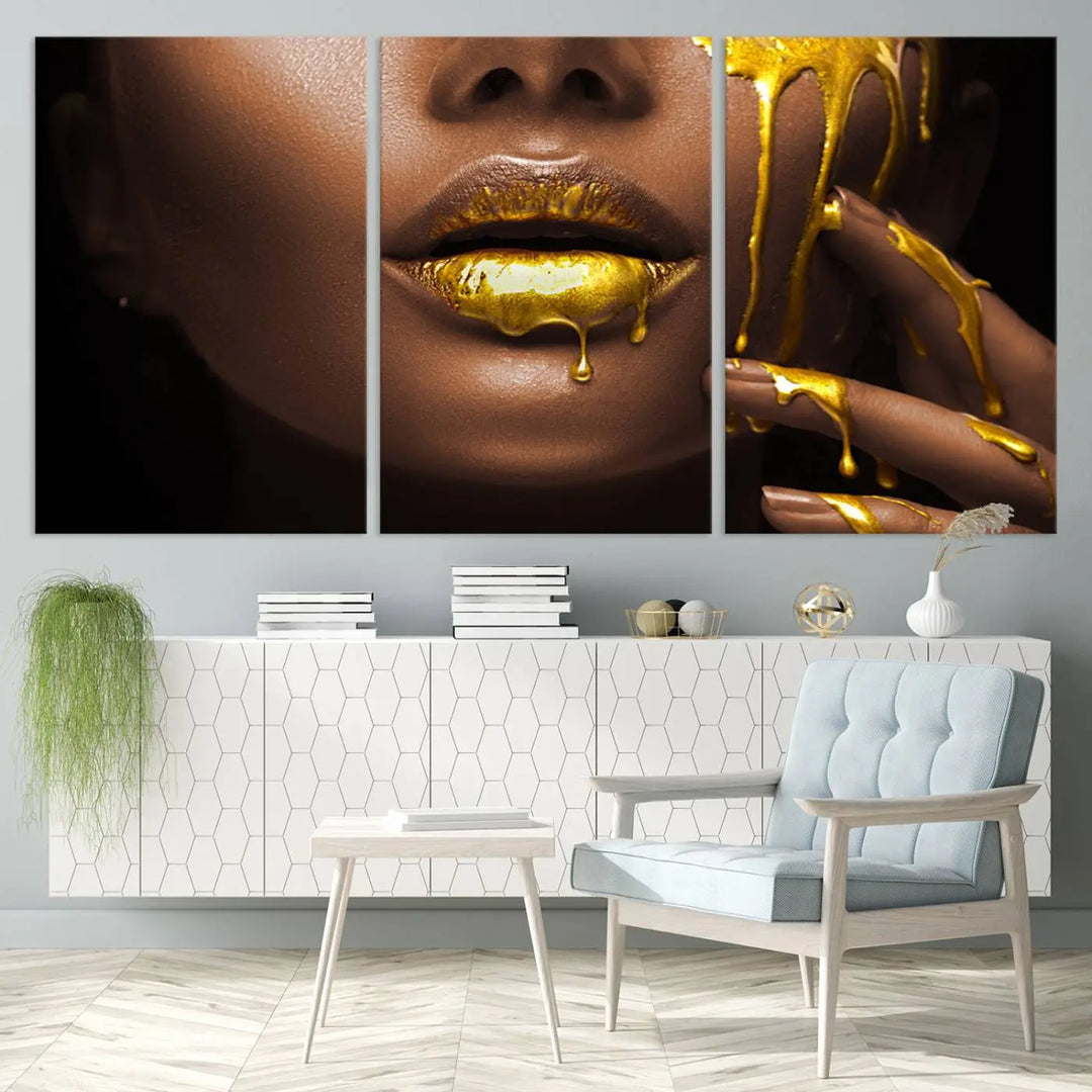 A triptych art display of the African American Art Black Woman Canvas Print, featuring gold-painted lips inspired by fashion and luxury, is elegantly arranged.